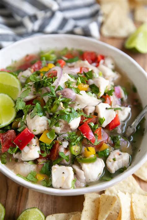 Cut the shrimp into small 1/2-inch pieces and transfer them to a large bowl. Marinate (cook) the ceviche. To the bowl, add the red onion, cucumber, tomato, cilantro, lime juice, orange juice, and salt + pepper to taste. Gently stir to combine. Cover the bowl with plastic wrap and chill for 15-20 minutes.